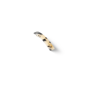 Sacrae Barrette Classique small white tokyo — worn in a low bun, side profile