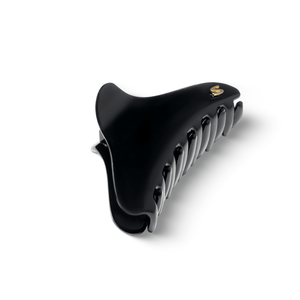 Large French Yoga Hair Clip glossy black — flatlay on dark background