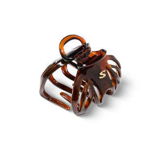 Sacrae Lena claw clip tortoise — worn at the temple, minimal styling