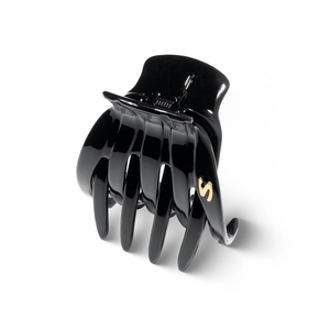 Sacrae Marina claw clip glossy black — worn in a half-up style