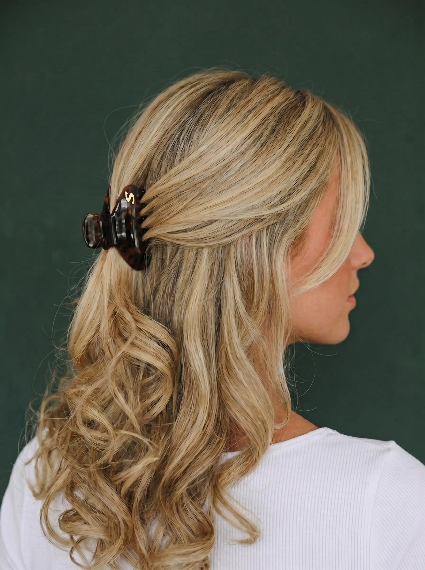 Model wearing Sacrae Eva Small Claw Clip in Tortoise, half-up hairstyle, back view