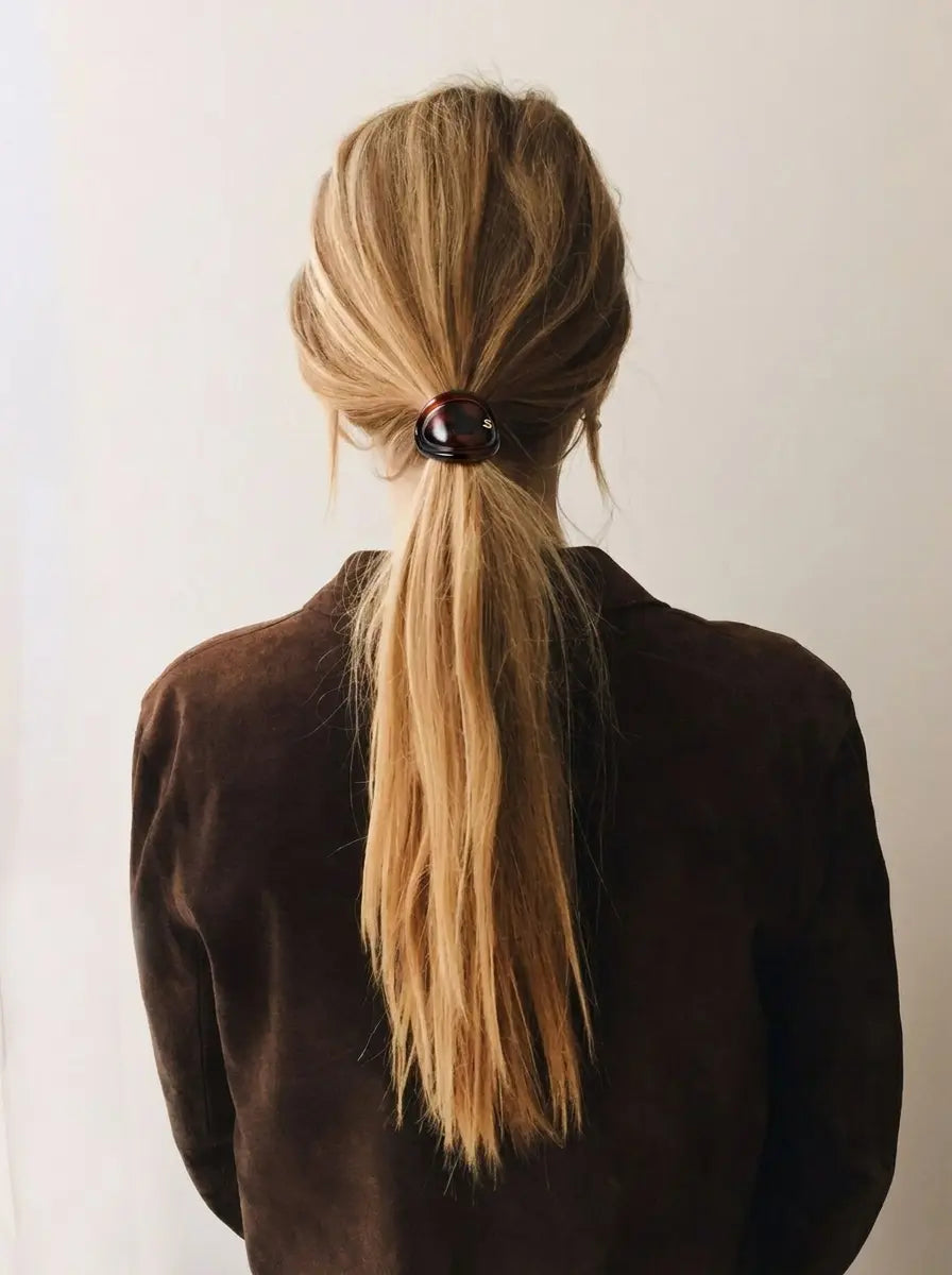 Model wearing Sacrae Charmé de Cheveux hair elastic in Tortoise, ponytail, back view