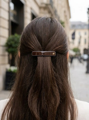 Model wearing Sacrae Barrette M Twilight Mirage Capsule Edition, half-up hairstyle, city, back view