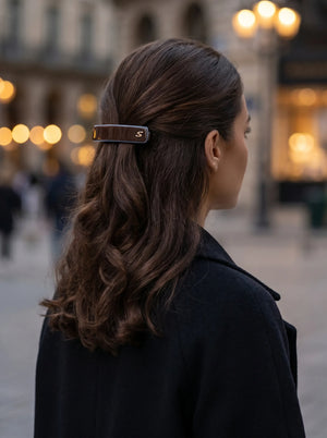 Model wearing Sacrae Barrette M Twilight Mirage Capsule Edition, half-up hairstyle, evening city