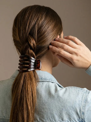 Model with twisted ponytail wearing Sacrae Marina Medium Claw Clip in Tortoise, back view