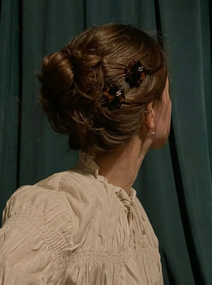 Sacrae Petite Fleur Clips in Tortoise styled in an updo, back view