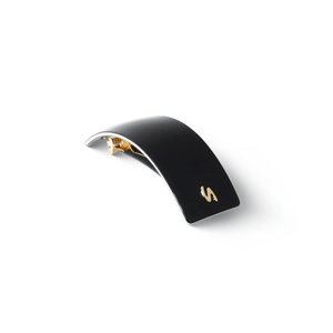Barrette Classique large black and cream — overhead flatlay on marble