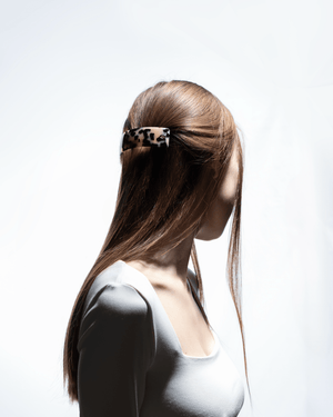 Barrette Classique large white tokyo — overhead flatlay on marble