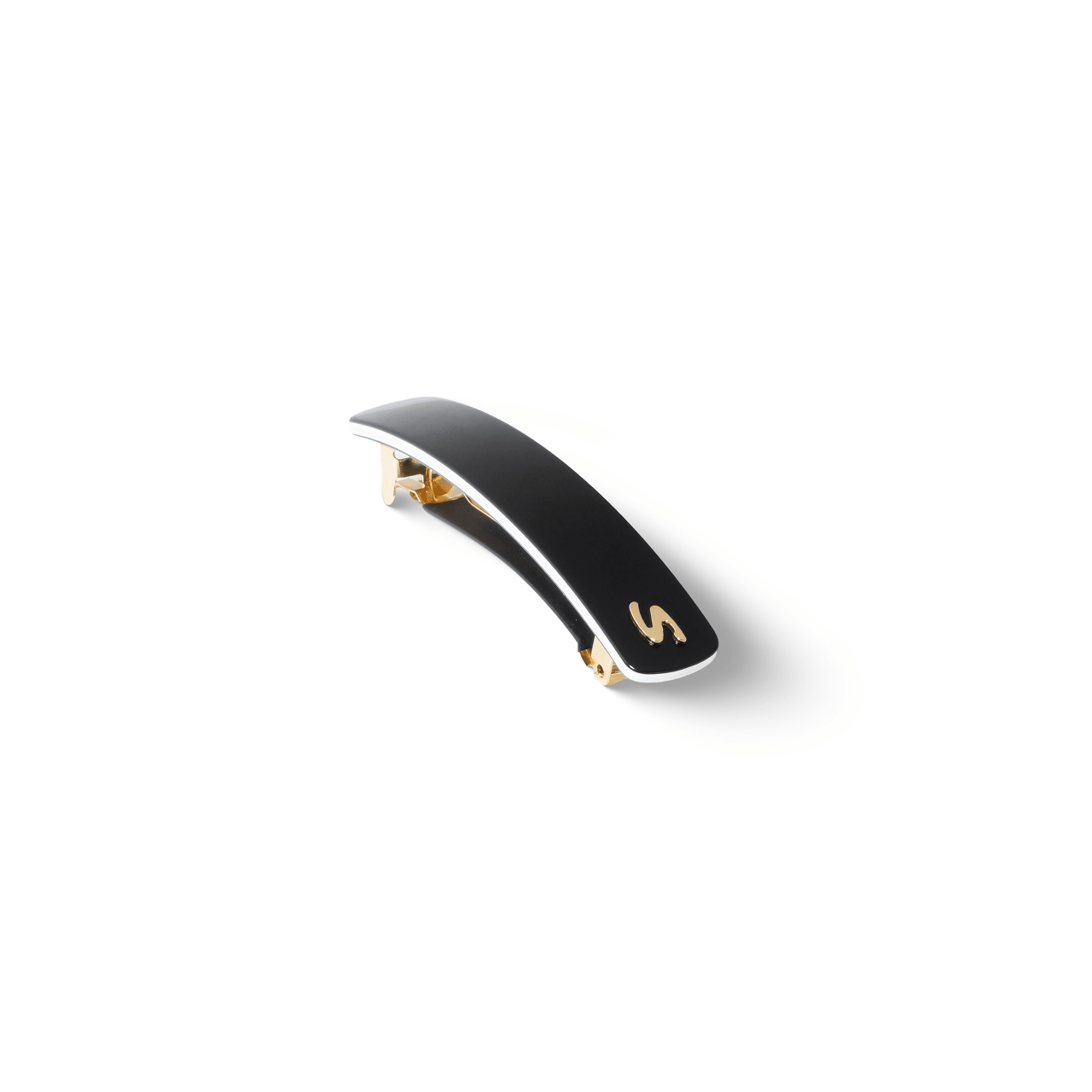 Sacrae Barrette Classique medium black and cream — worn in a low bun, side profile