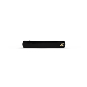 Sacrae Barrette Classique medium in black and cream — polished acetate on a clean surface
