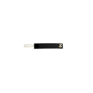 Sacrae Barrette Classique small in black and cream — polished acetate on a clean surface