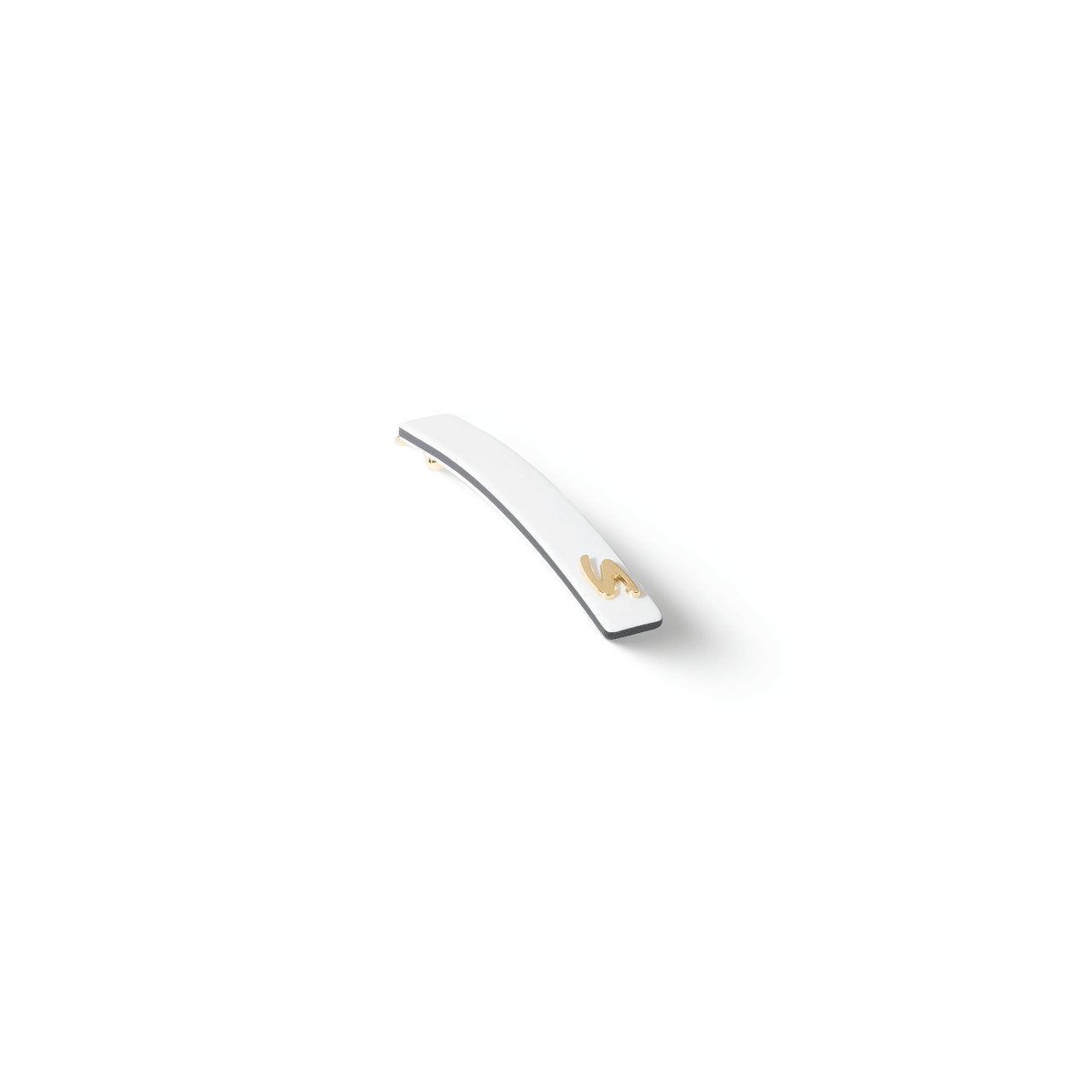 Sacrae Barrette Classique small cream and black — worn in a low bun, side profile