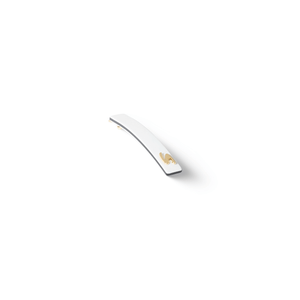 Sacrae Barrette Classique small cream and black — worn in a low bun, side profile