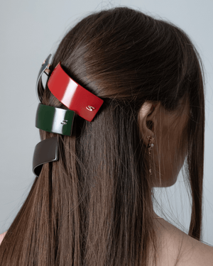 Sacrae Barrette L midnight rouge — side view showing acetate depth