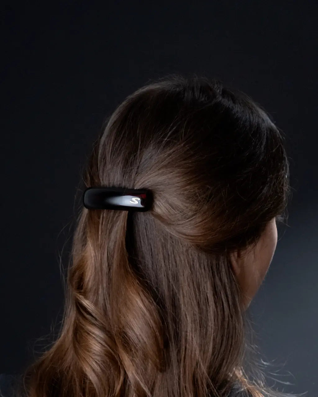Sacrae barrette in dark brown hair — natural styling editorial