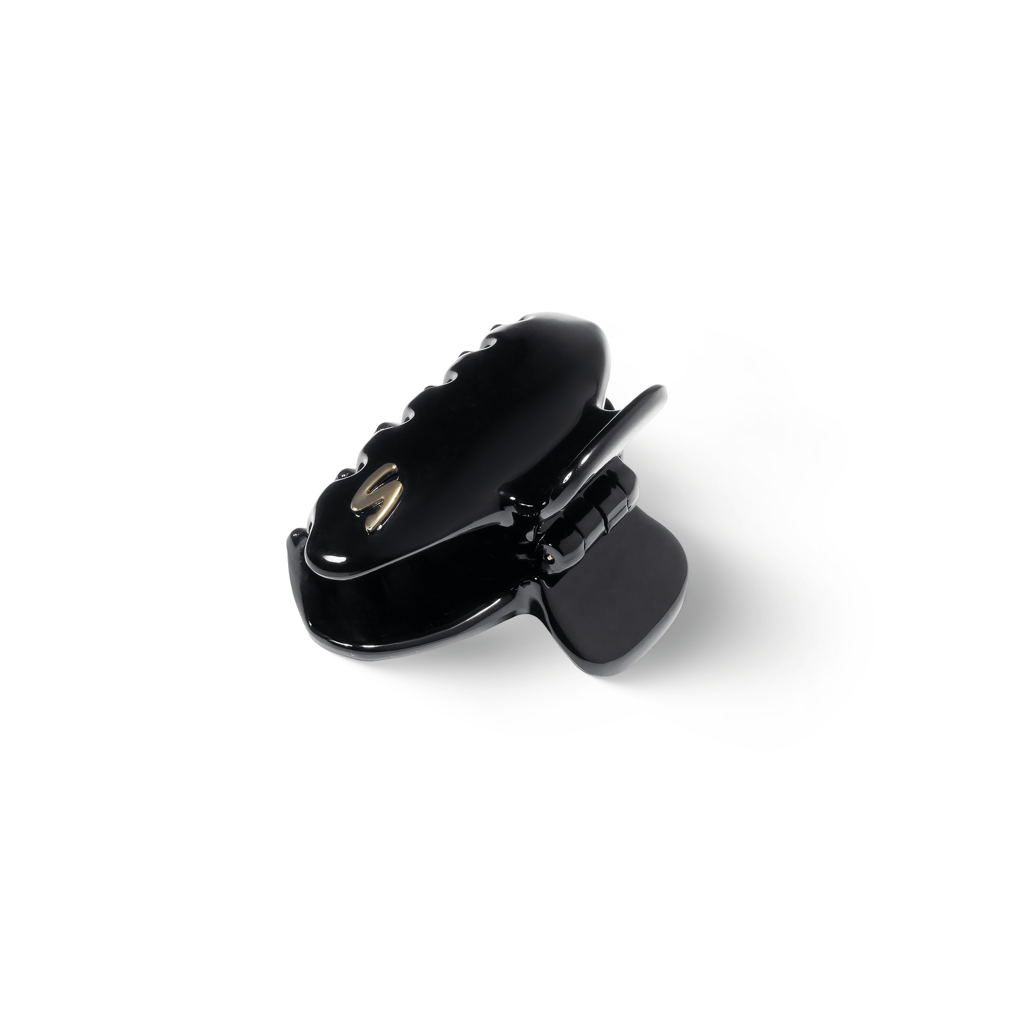 Sacrae Eva claw clip glossy black — worn pinned back at the side