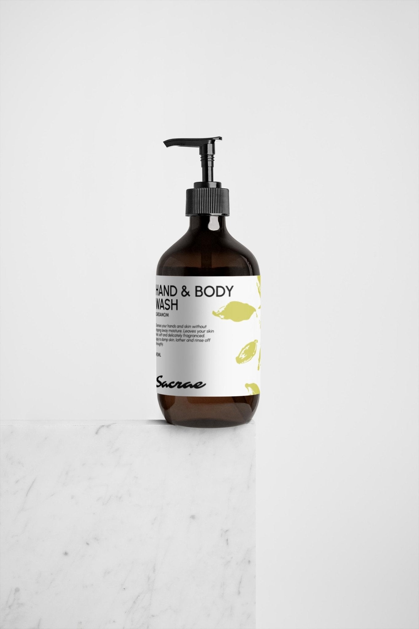 Sacrae Hand & Body Wash Ginger & Smoky Cardamom — overhead shot on marble