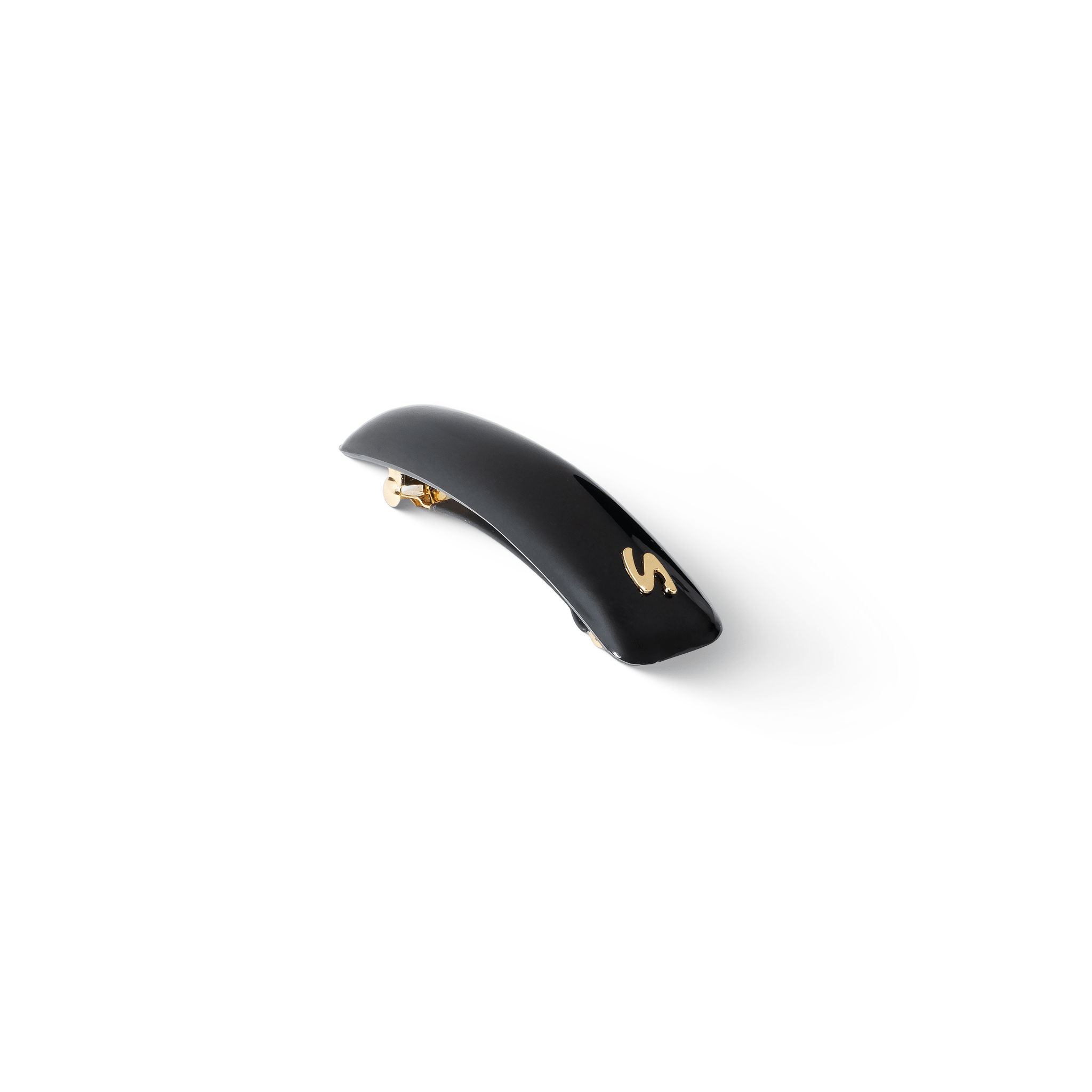 Jonc Classique Barrette glossy black — editorial flatlay on dark surface