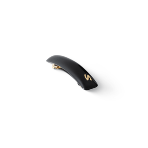 Jonc Classique Barrette glossy black — editorial flatlay on dark surface