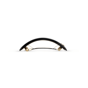 Sacrae Jonc Majesté glossy black — worn in a twisted low ponytail