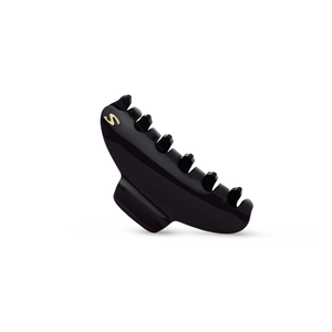 Sacrae Lumière clip glossy black — worn flat across a chignon