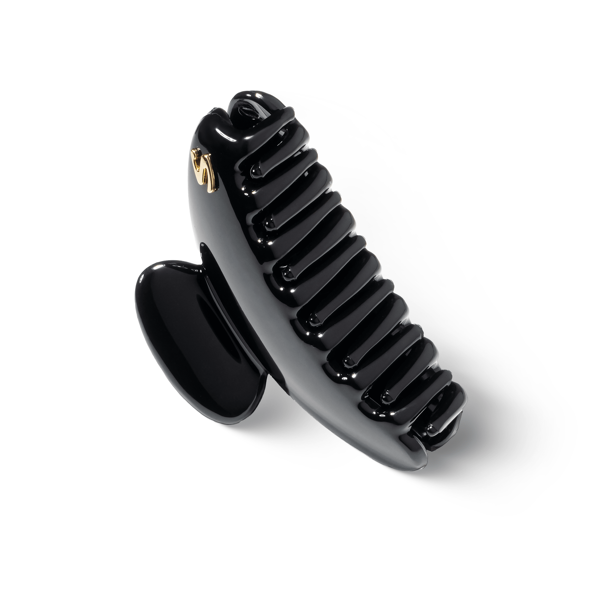 Sacrae Lumière clip glossy black — close-up of acetate surface and engraving