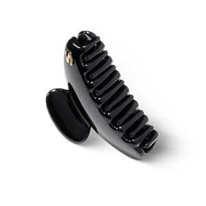 Sacrae Lumière clip glossy black — close-up of acetate surface and engraving