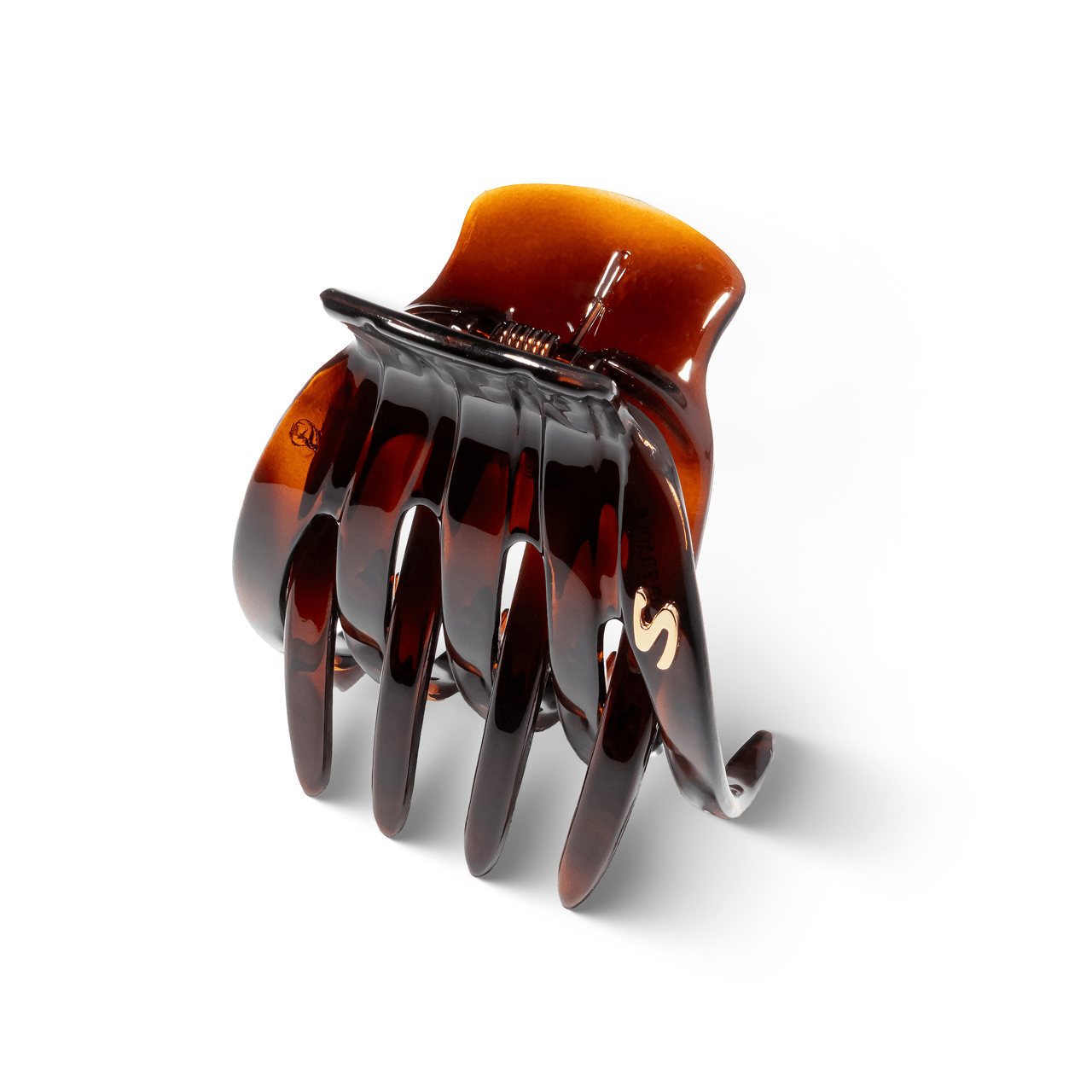 Sacrae Marina claw clip tortoise — worn in a half-up style