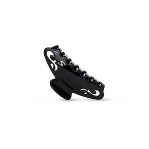Sacrae Melissa claw clip glossy black — worn in a full updo, side profile