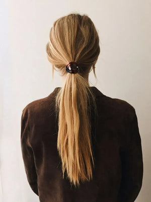 Model wearing Sacrae Charmé de Cheveux hair elastic in Tortoise, ponytail, back view
