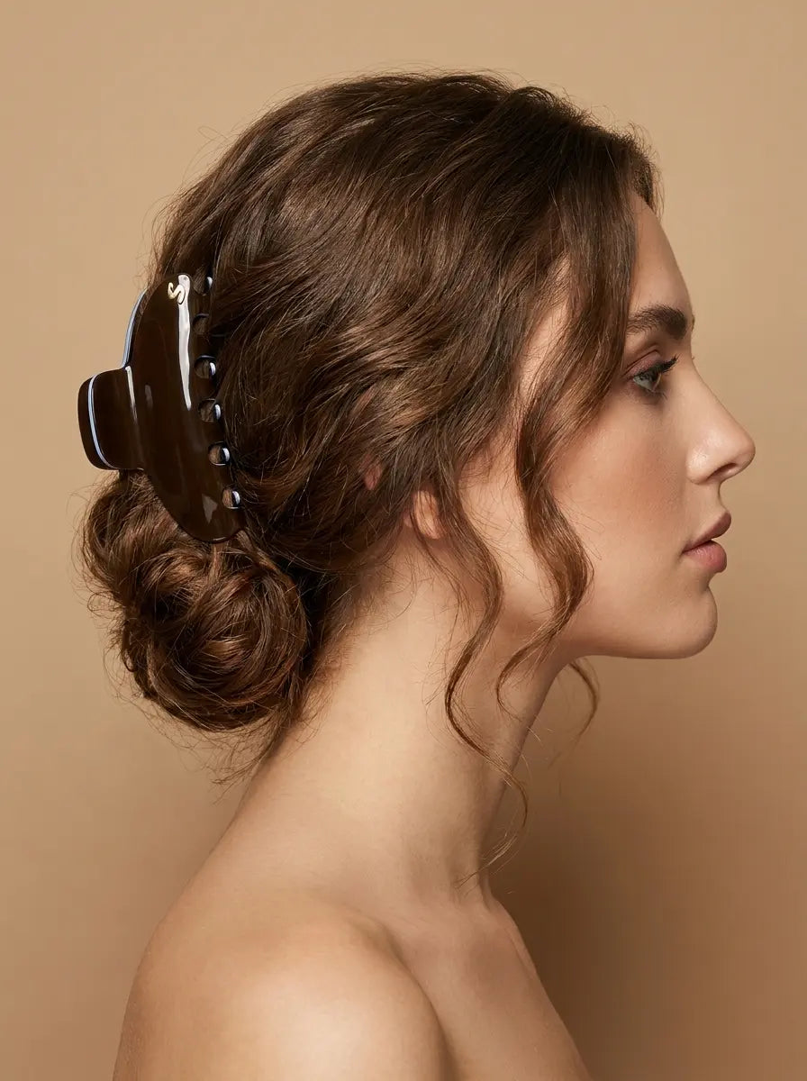 Sacrae Pince L Twilight Mirage Capsule Edition on a low bun, side view