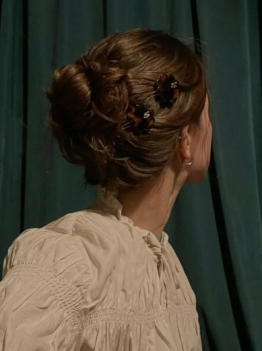 Sacrae Petite Fleur Clips in Tortoise styled in an updo, back view