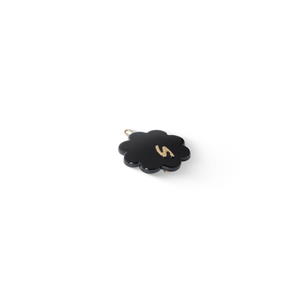 Petite Fleur Clip glossy black — petal detail and S centre close-up