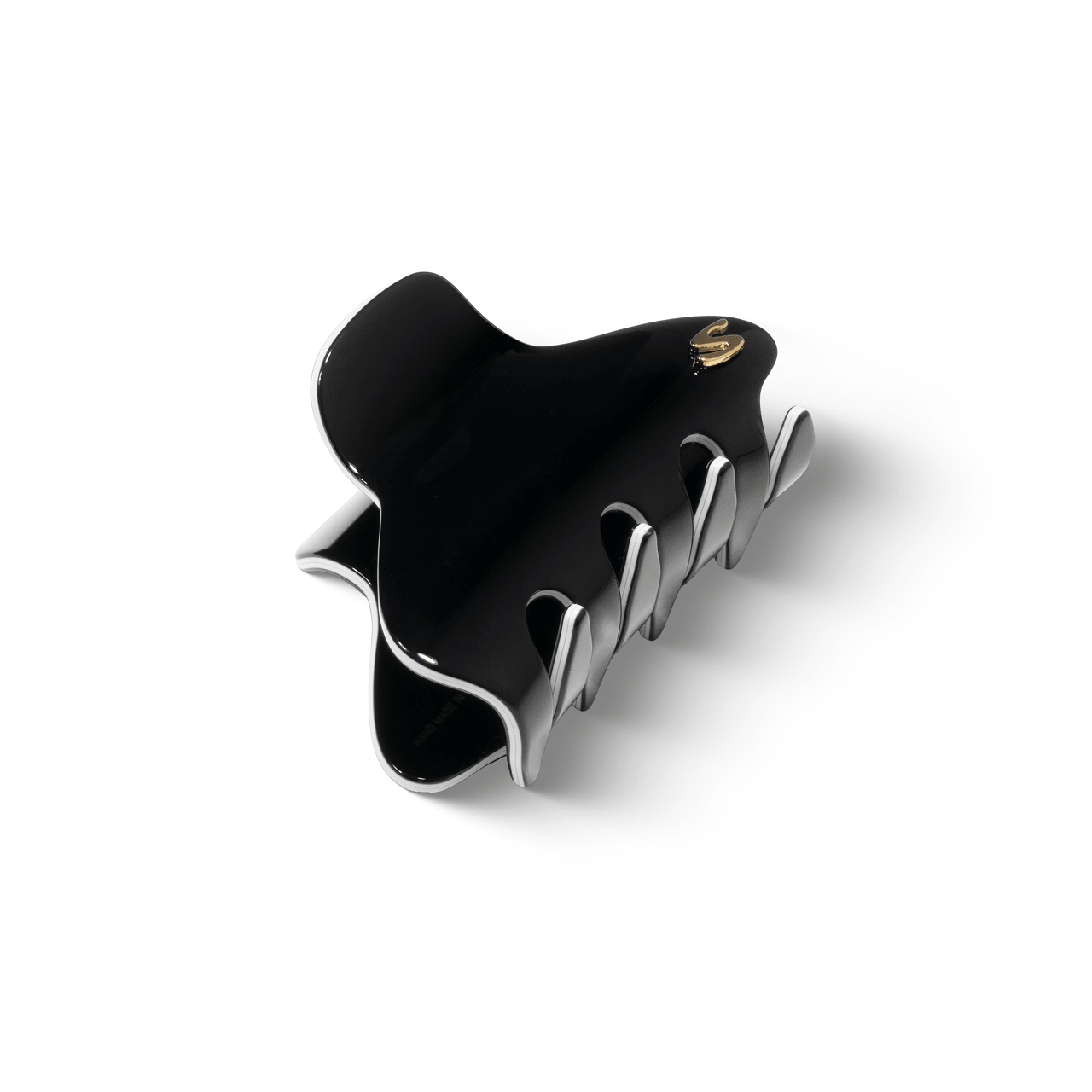 Sacrae Pince Iconique medium black and cream — worn in a half-up style, natural light