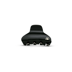 Sacrae Pince Iconique medium in black and cream — acetate claw clip against neutral background