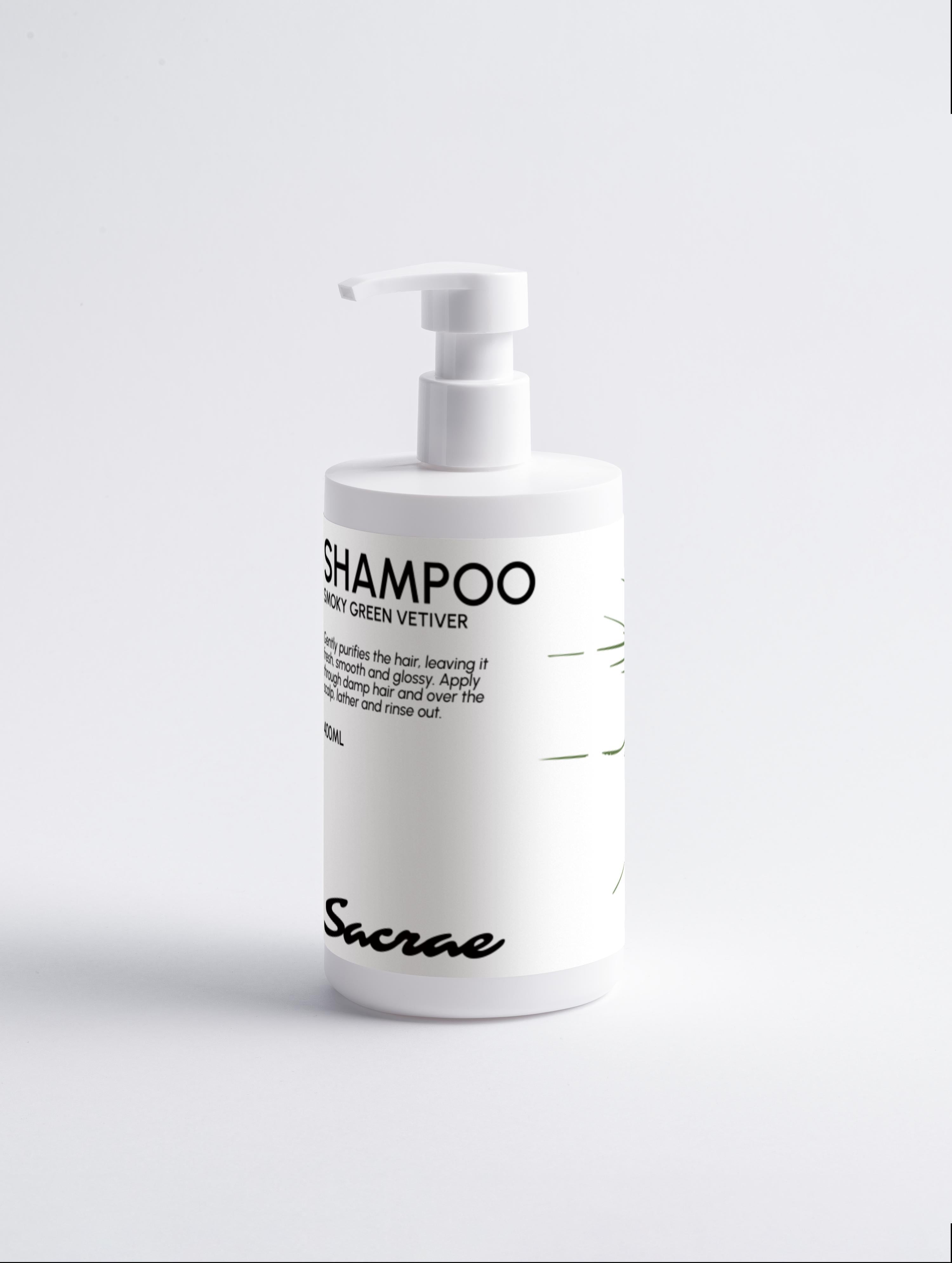 Sacrae Gloss Shampoo Smoky Green Vetiver — white pump bottle, front label, on soft grey