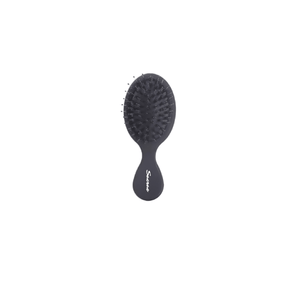 Sacrae Mini Boar Hair Brush — compact travel brush on clean background